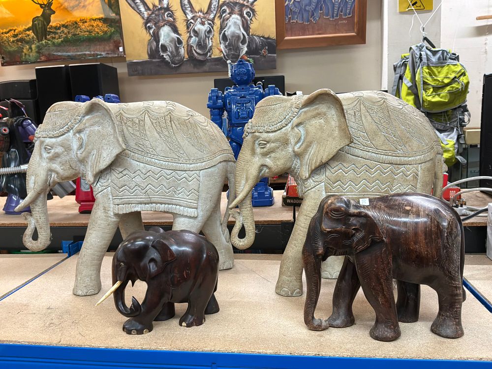 Lot 217: A Collection of Four Decorative Elephant Ornaments in Composite and Carved Wood