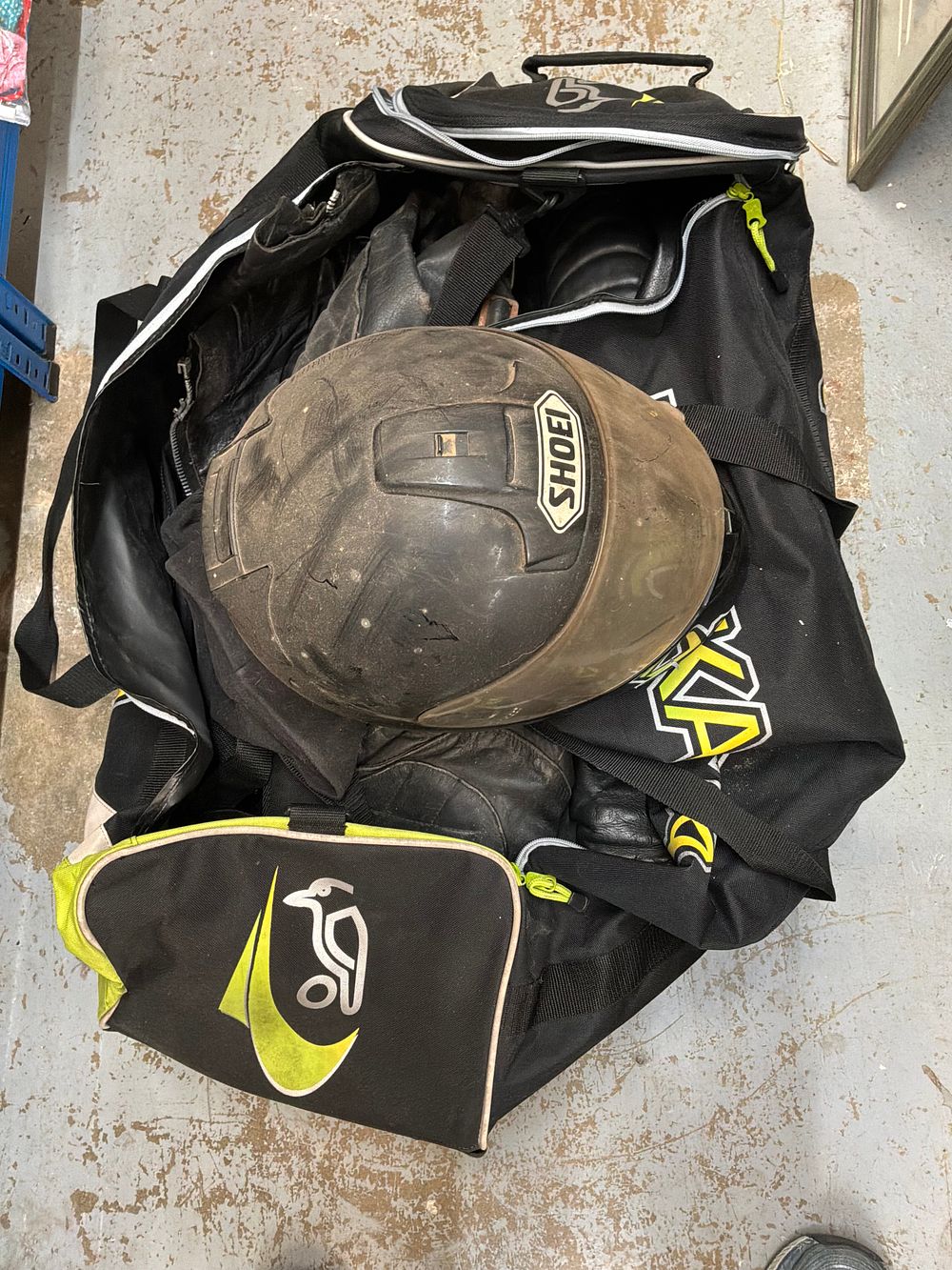 Lot 221: A Collection of Motorcycle Protective Equipment and Gear Bag Including Shoei and J&S Accessories Examples