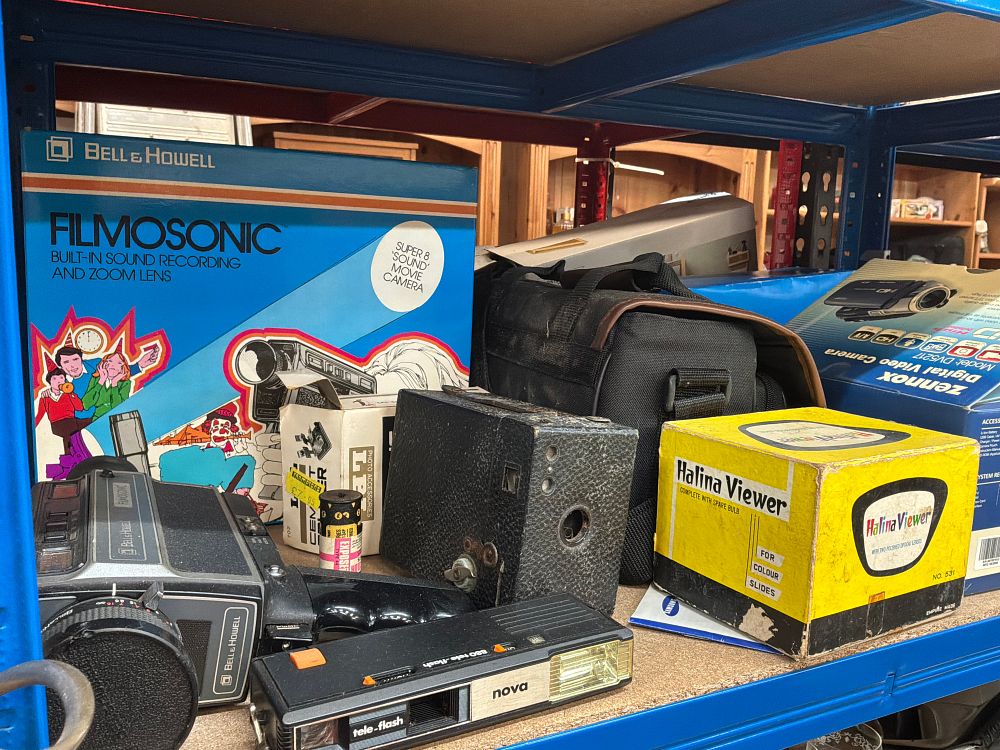 Lot 229: A Collection of Vintage and Modern Photographic Equipment including Bell and Howell and Canon Examples