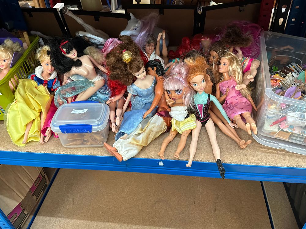 Lot 231: A Collection of Fashion and Character Dolls Including Disney and Barbie style Examples