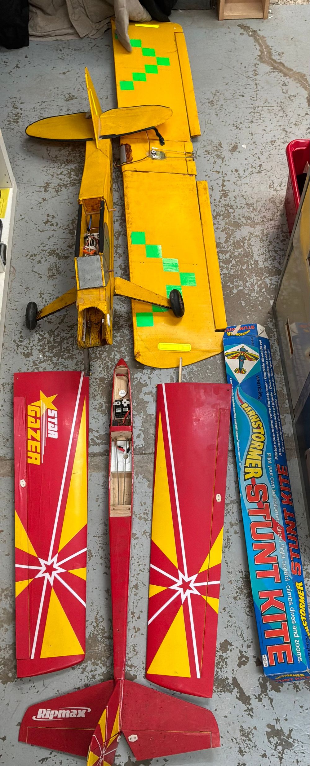 Lot 264: A Group of Two Radio Controlled Model Aircraft and a Mettoy Barnstormer Stunt Kite in Case