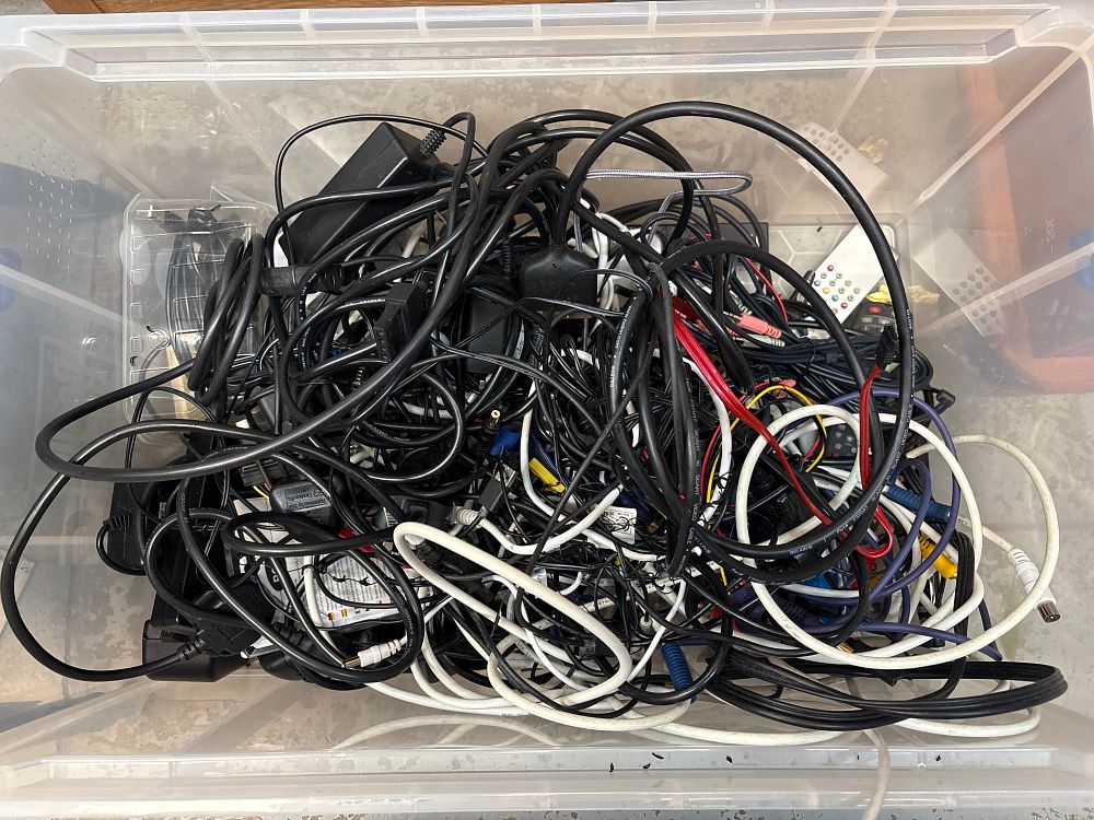 Lot 287: A Collection of Assorted Consumer Electronics Cables, Power Adapters, and Peripheral Accessories including Belkin Examples