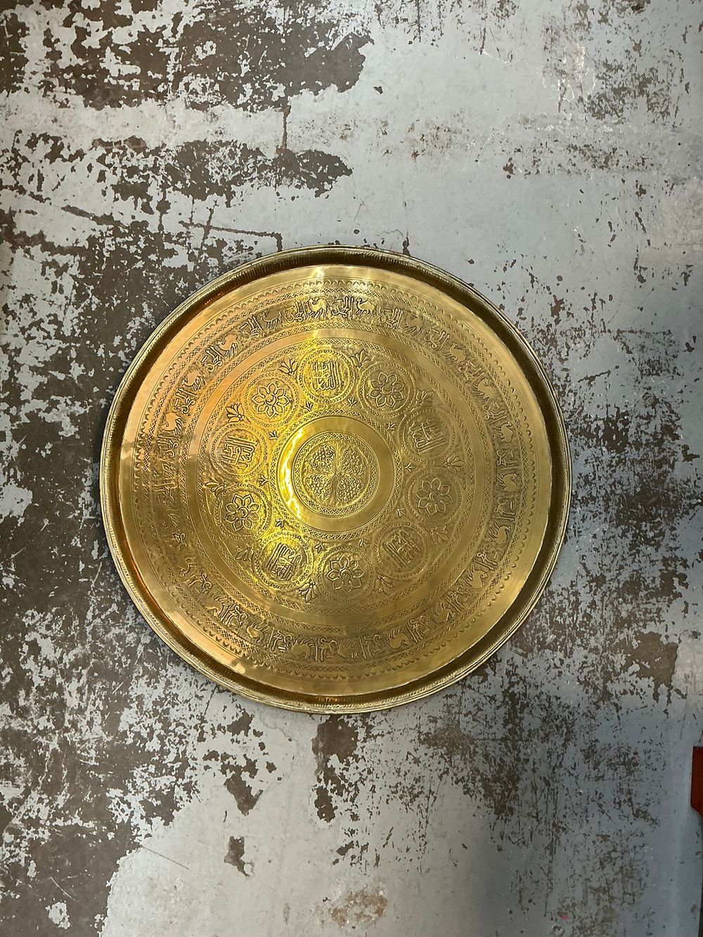 Lot 312: A Middle Eastern style Hammered and Chased Brass Presentation Tray