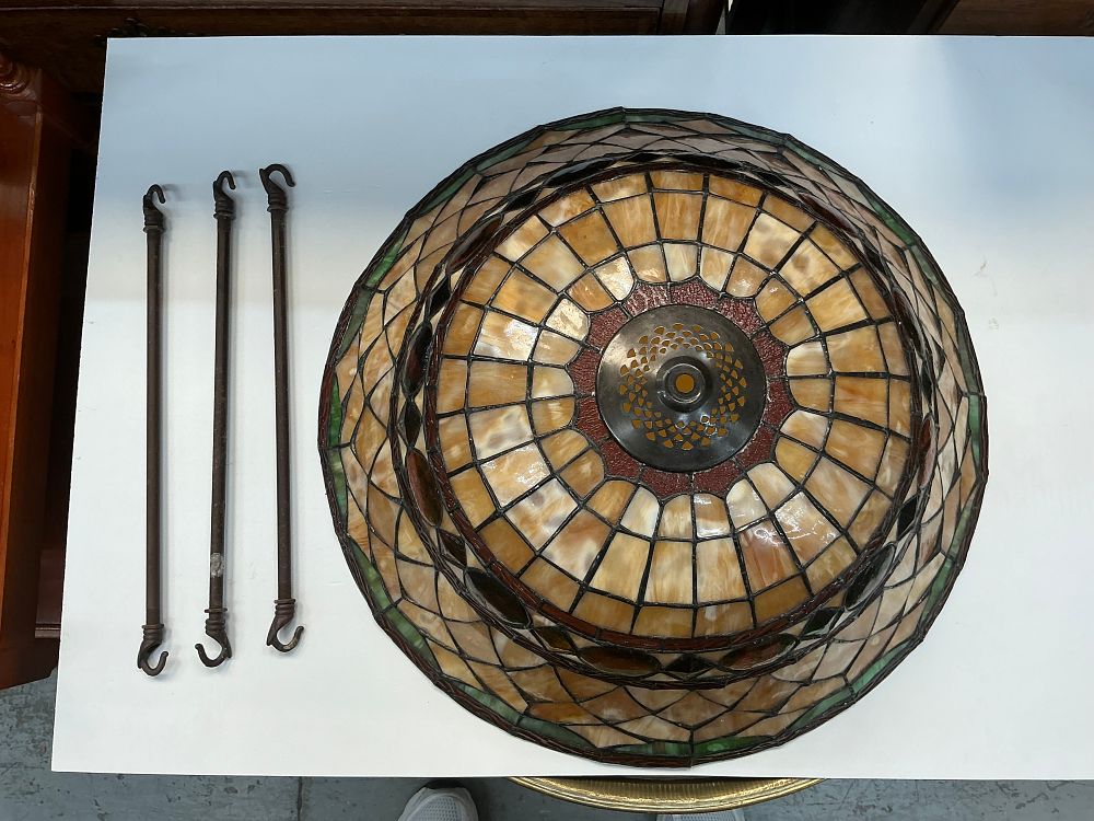 Lot 313: A Leaded Slag Glass Hanging Lamp Shade with Three Hanging Rods