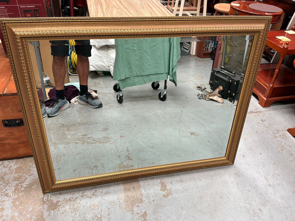 Lot 335: A Large Neoclassical Style Gilded Wood and Composition Wall Mirror with Beveled Glass