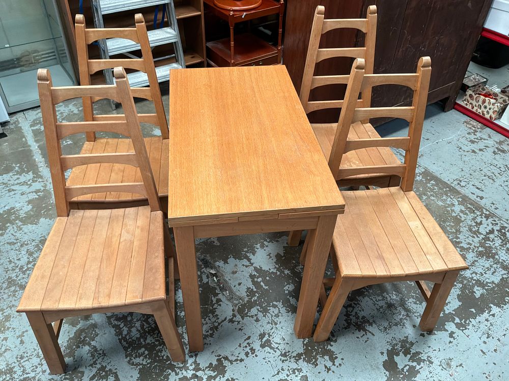 Lot 343: A Set of Four Beech style Ladder Back Dining Chairs and a Matching Drop Leaf Table