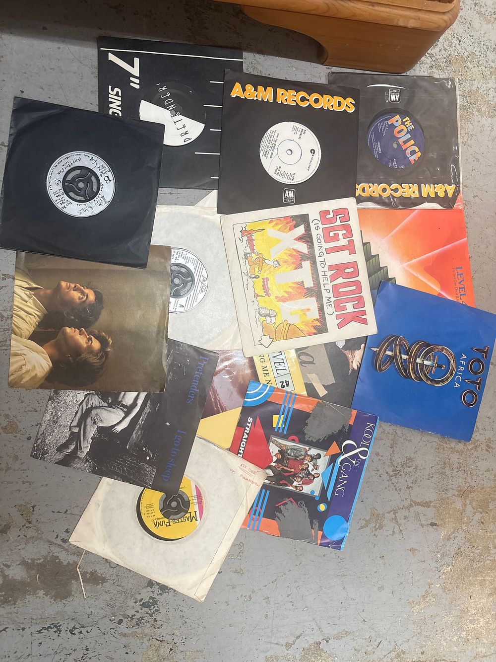Lot 364: A Collection of Approximately Sixty Vinyl Seven Inch Singles Including Toto and The Police Examples