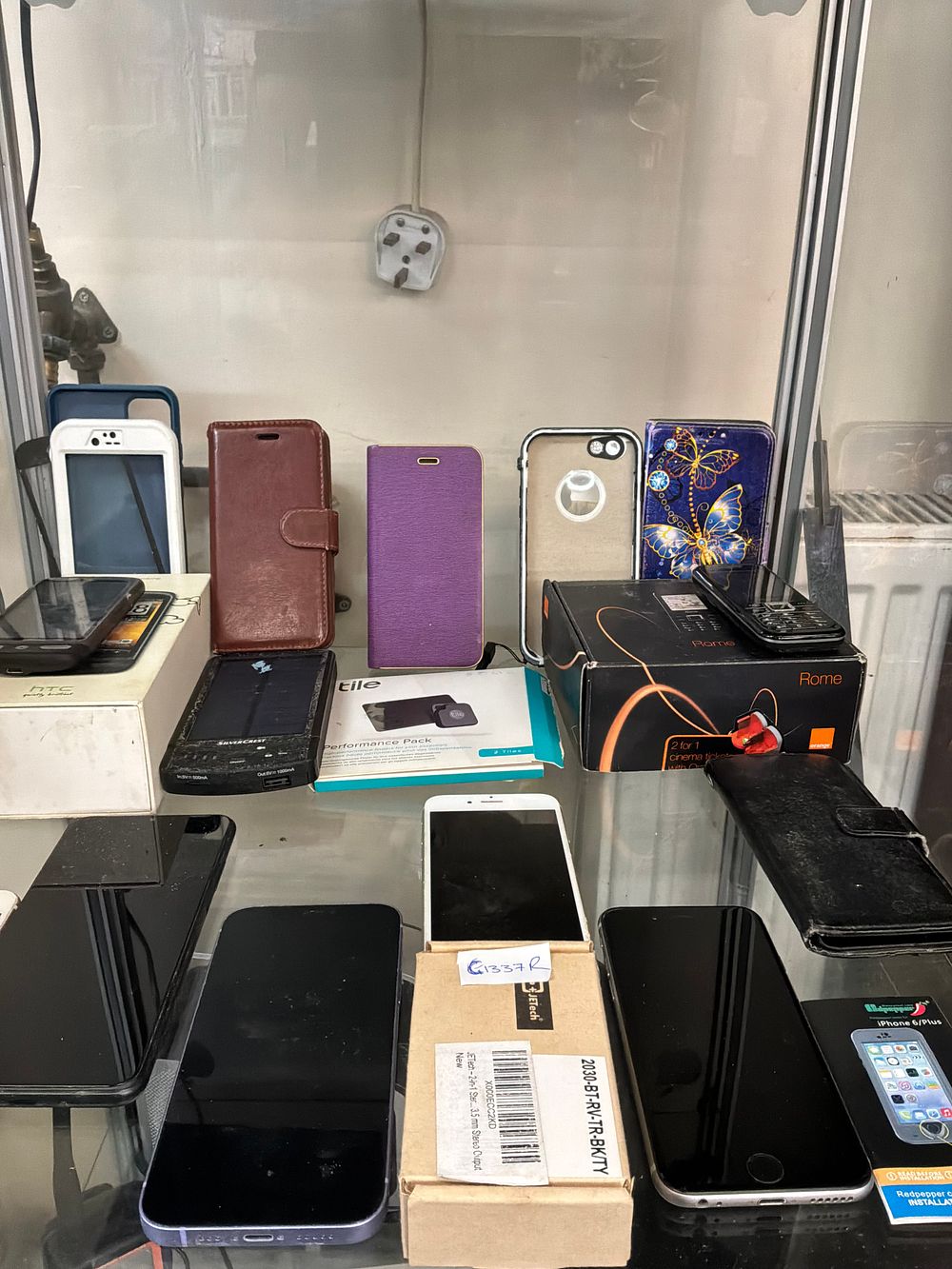 Lot 399: A Collection of Mobile Devices and Accessories Including Apple Samsung and HTC Examples