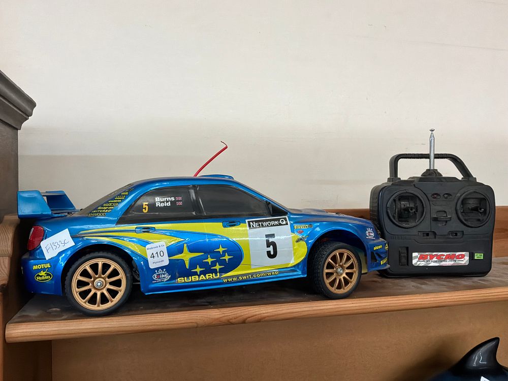 Lot 410: A Large Scale  Radio Controlled Subaru Impreza WRC Rally Car with Controller