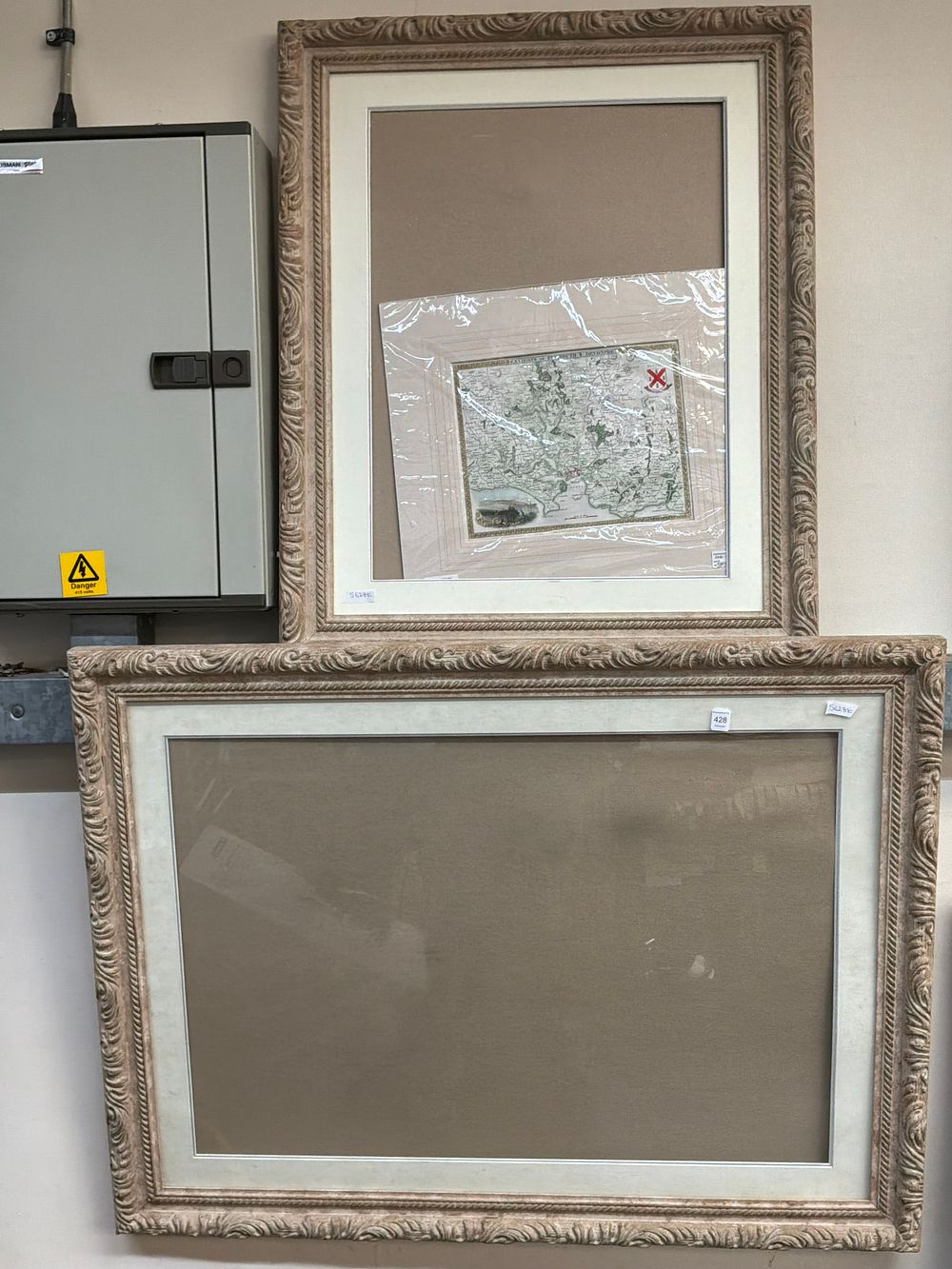 Lot 428: A Pair of Ornate Lime Washed style Wooden Picture Frames Including One Hand Coloured Map
