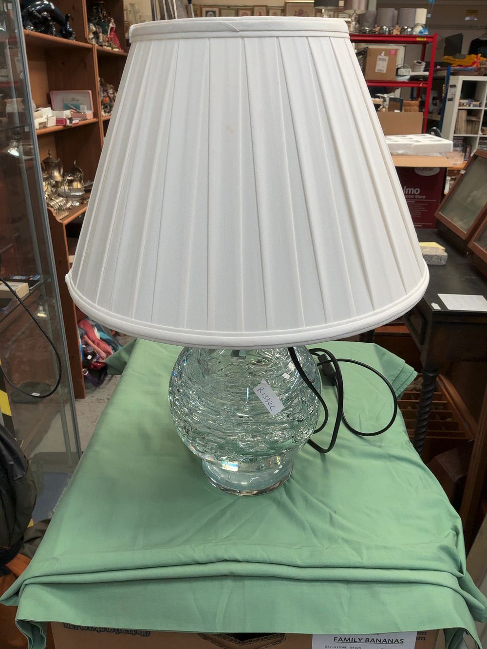 Lot 435: A Heavy Textured Clear Glass Table Lamp with Pleated Fabric Shade