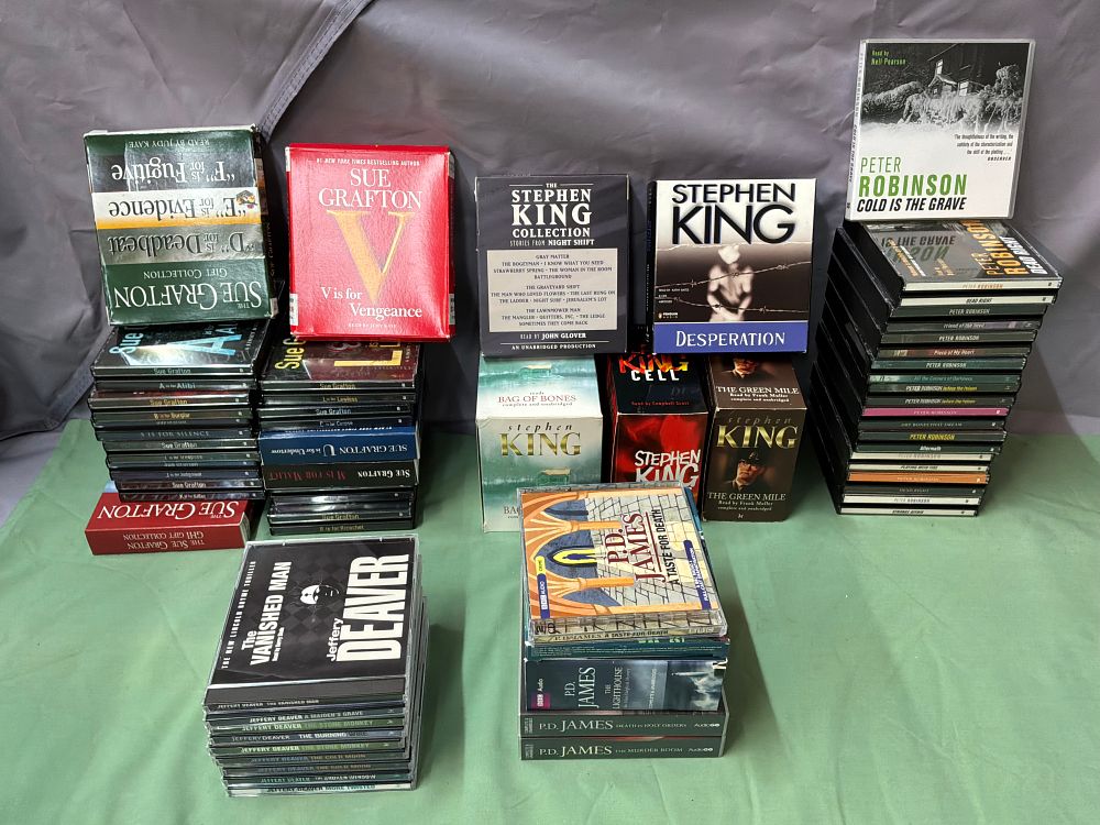 Lot 5: A Collection of Audiobook Compact Discs Including Stephen King and Sue Grafton Titles