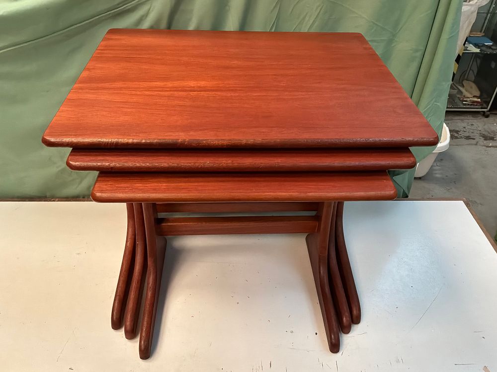Lot 19: A Trio of Mid Century Modern Teak style Nesting Tables
