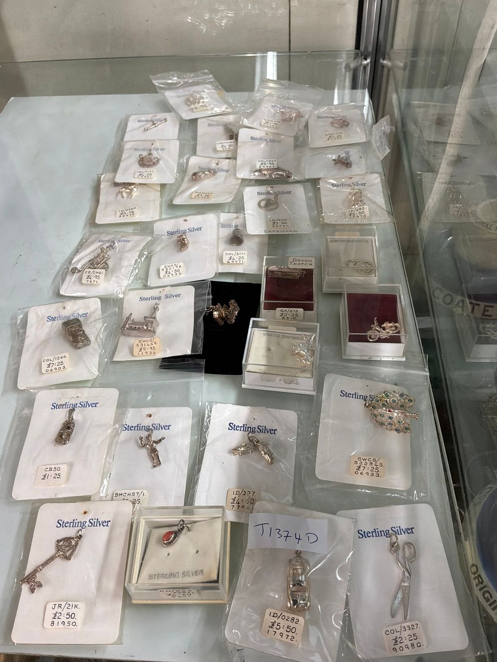 Lot 52: A Collection of Sterling Silver Pendants and Charms