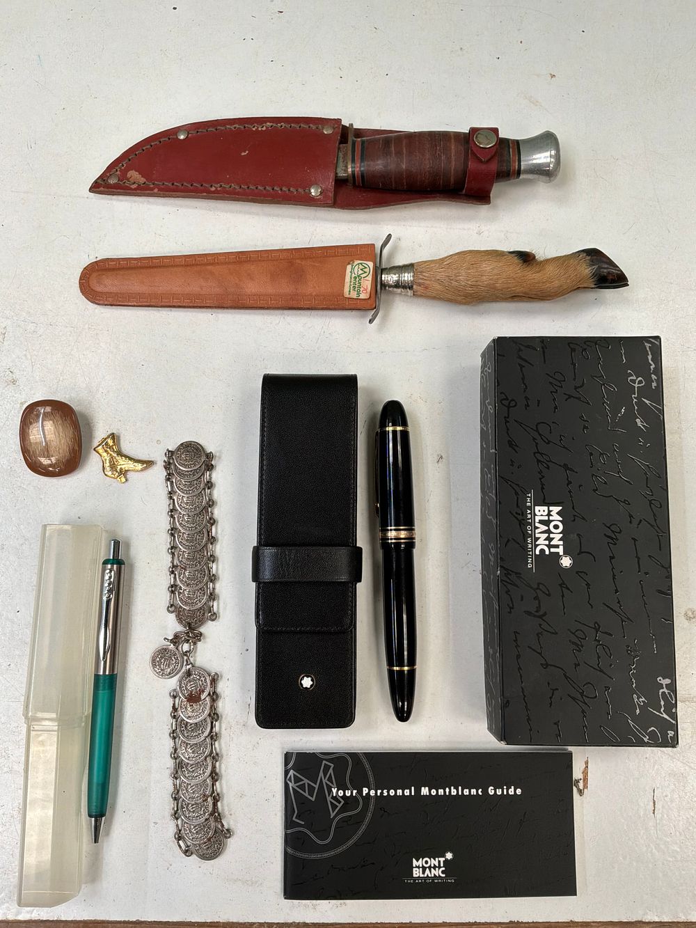 Lot 61: A Collection of Knives and Writing Instruments Including Montblanc and J. Nowill & Sons Examples
