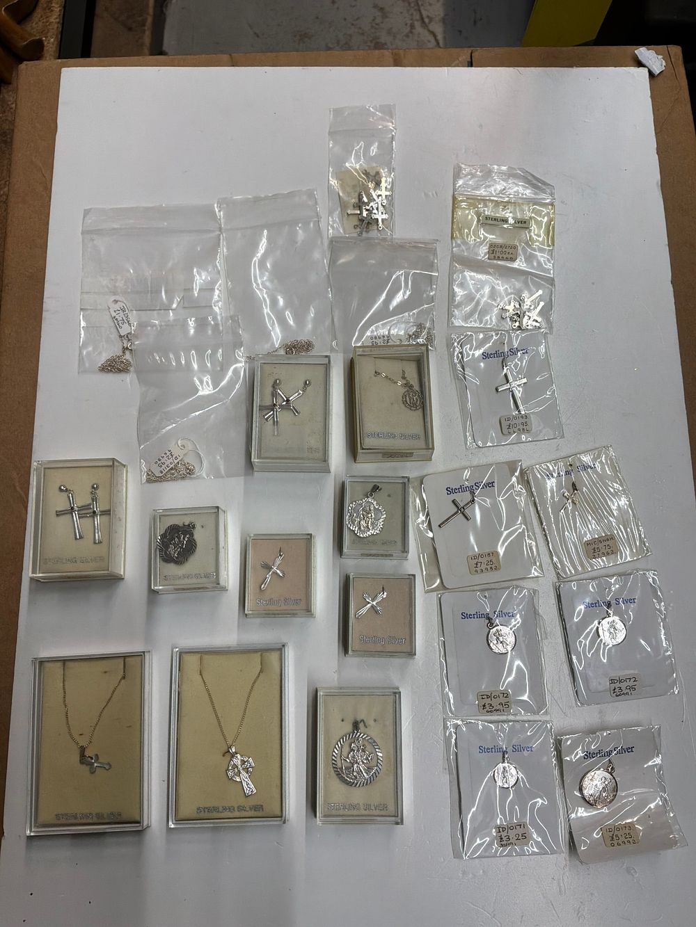 Lot 98: A Collection of Sterling Silver Religious Pendants and Necklaces including St Christopher Medals