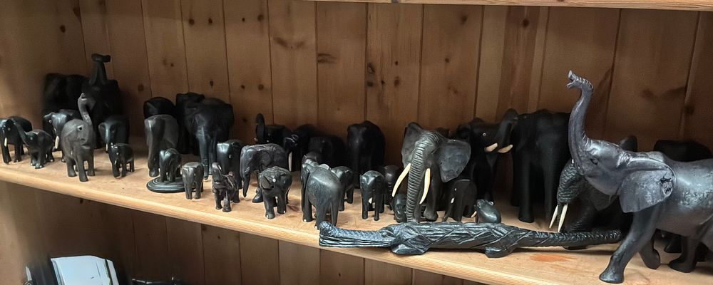 Lot 121: A Collection of Carved Ebony style Elephant Figurines and One Crocodile Figurine