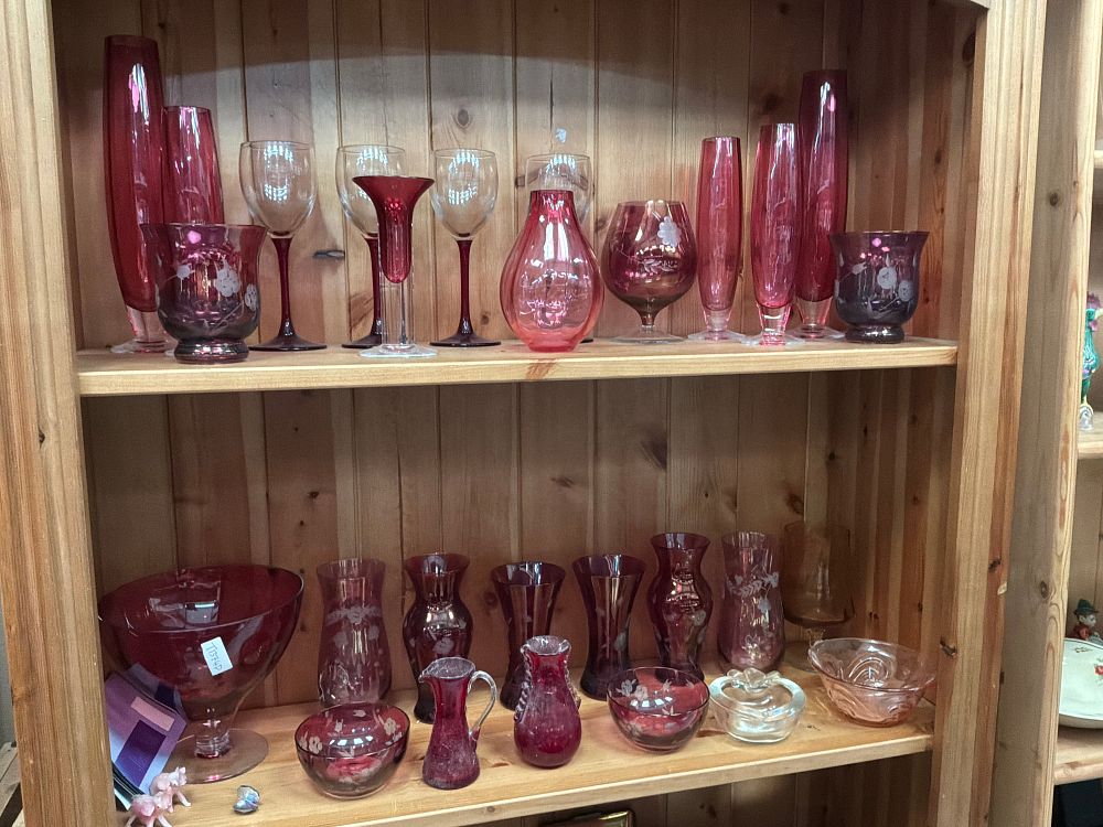 Lot 125: A Collection of Cranberry and Ruby style Glassware Including Etched and Stemmed Examples