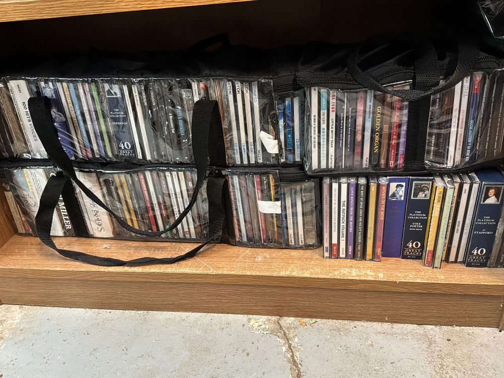 Lot 151: A Collection of Compact Discs and Audiobooks in Clear Storage Cases