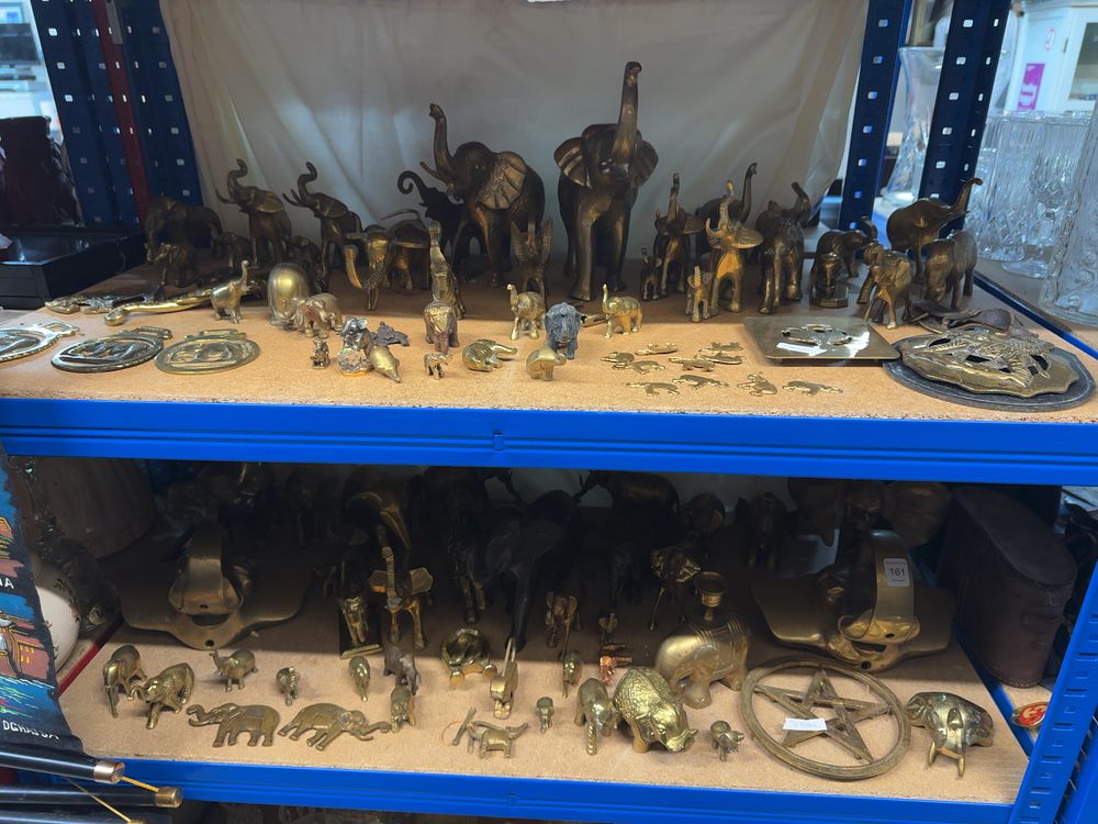 Lot 161: A Collection of Elephant Figurines and Themed Brassware