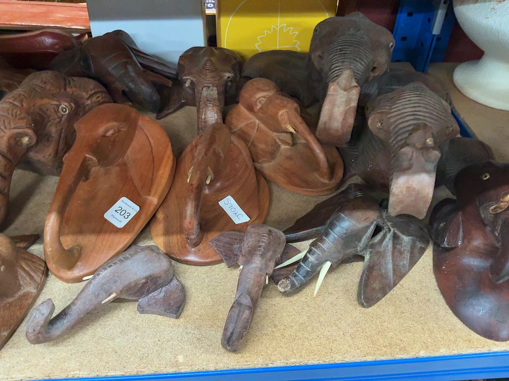 Lot 203: A Collection of Carved Wooden Elephant Wall Plaques and Figurines