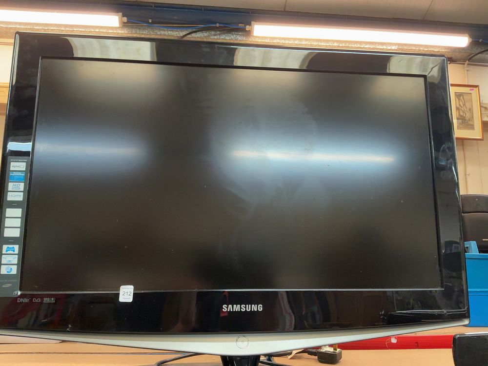 Lot 212: A Mixed Lot of Two Flat Screen Televisions Including Samsung and Technika Examples