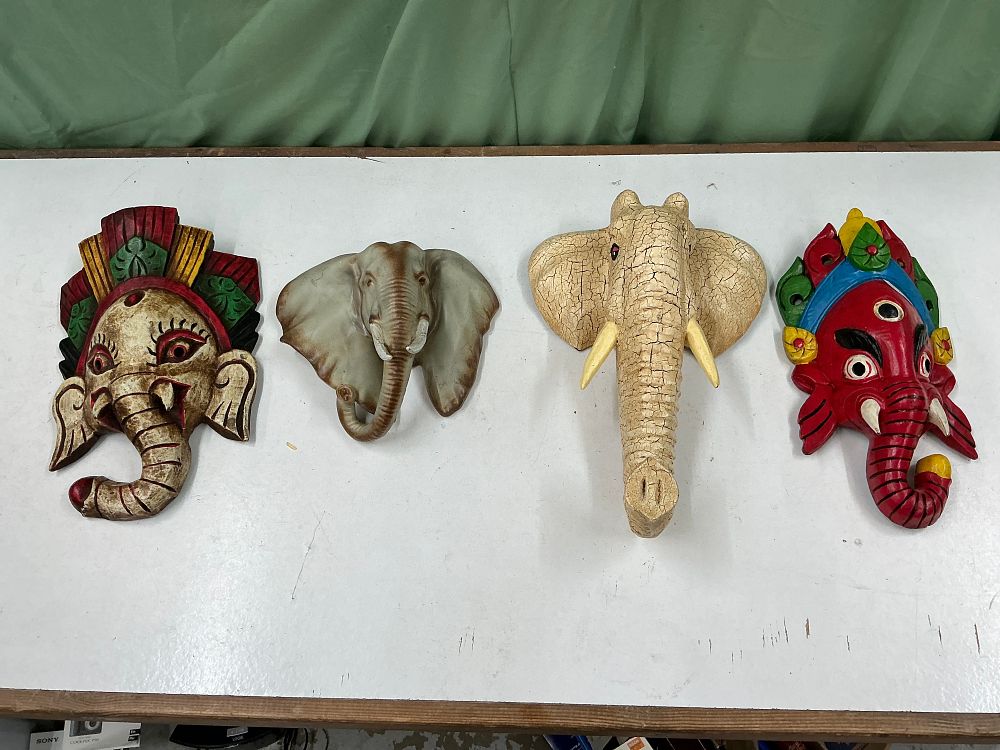 Lot 221: A Collection of Four Decorative Elephant style Wall Masks and Plaques