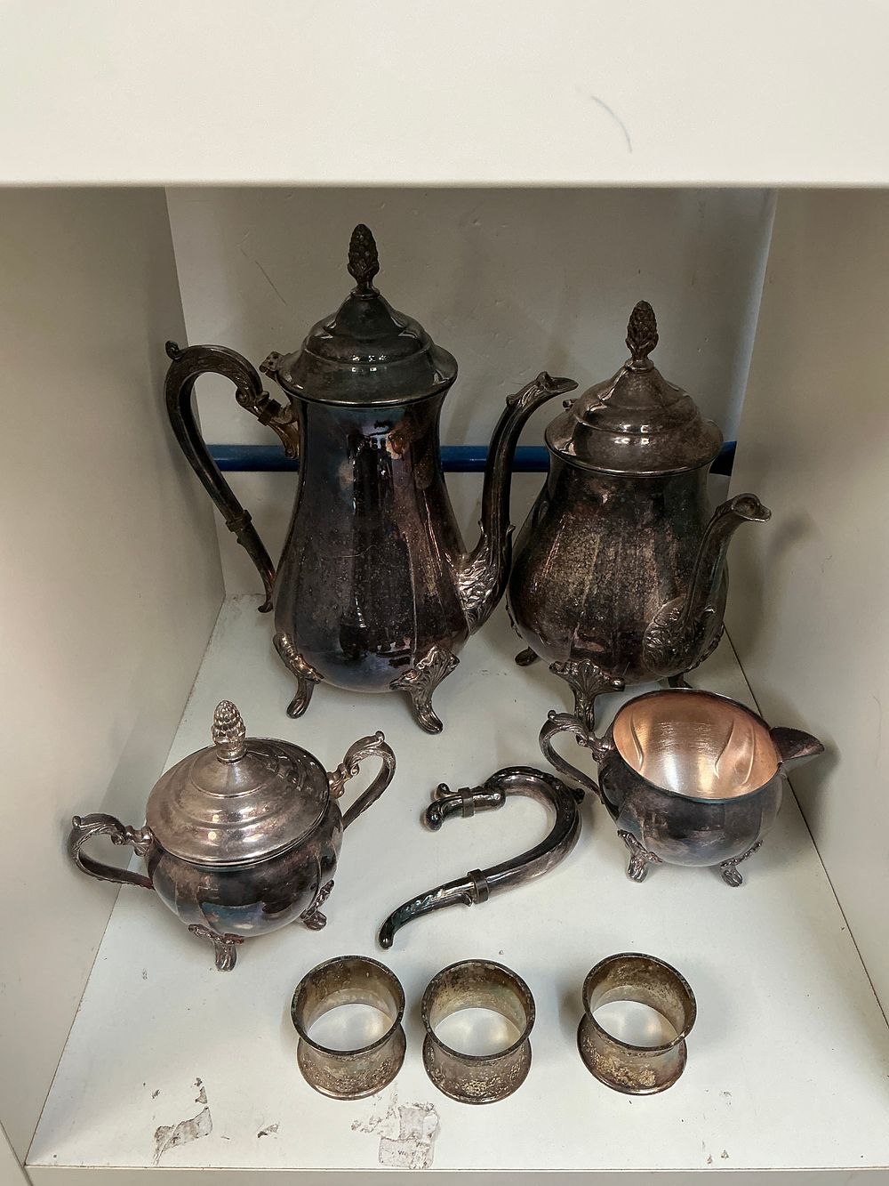 Lot 233: A Four Piece Viners of Sheffield Silver Plated Tea and Coffee Set with Three Matching Napkin Rings