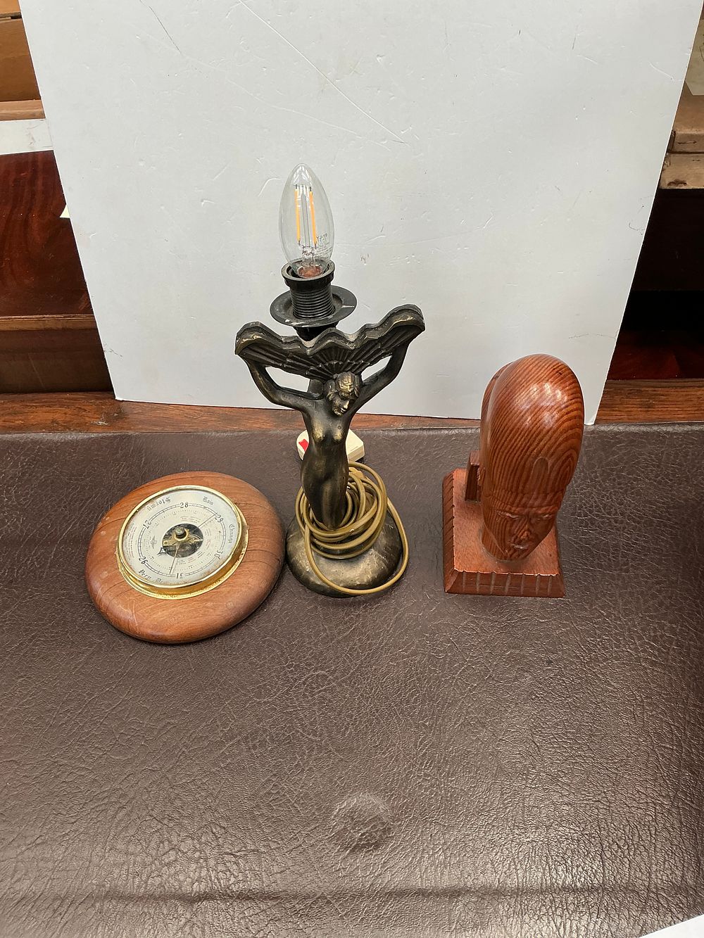 Lot 235: A Group of Decorative Objects including a Figural Lamp and an Aneroid Barometer