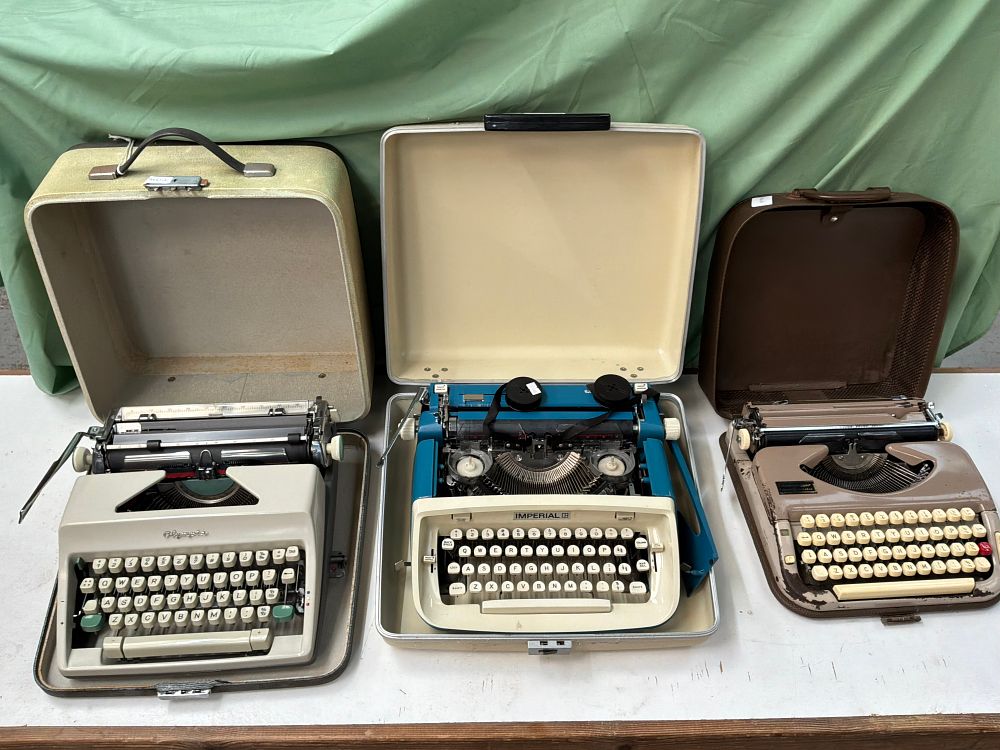 Lot 255: A Trio of Vintage Manual Portable Typewriters Including Olympia and Imperial Examples in Cases