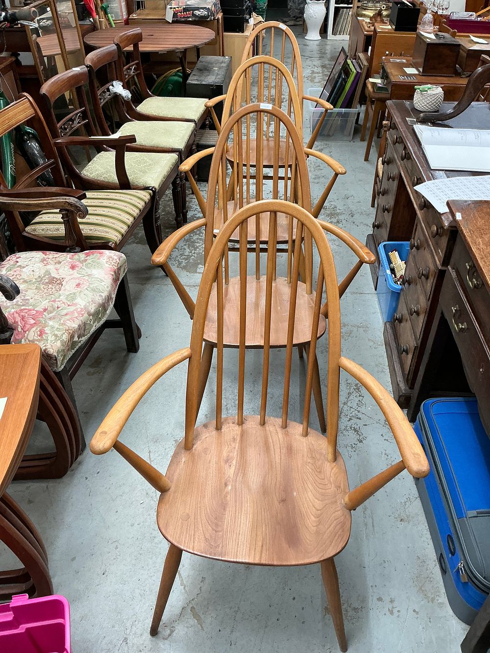 Lot 256: A Set of Four Ercol Windsor Style Elm and Beech Chairs