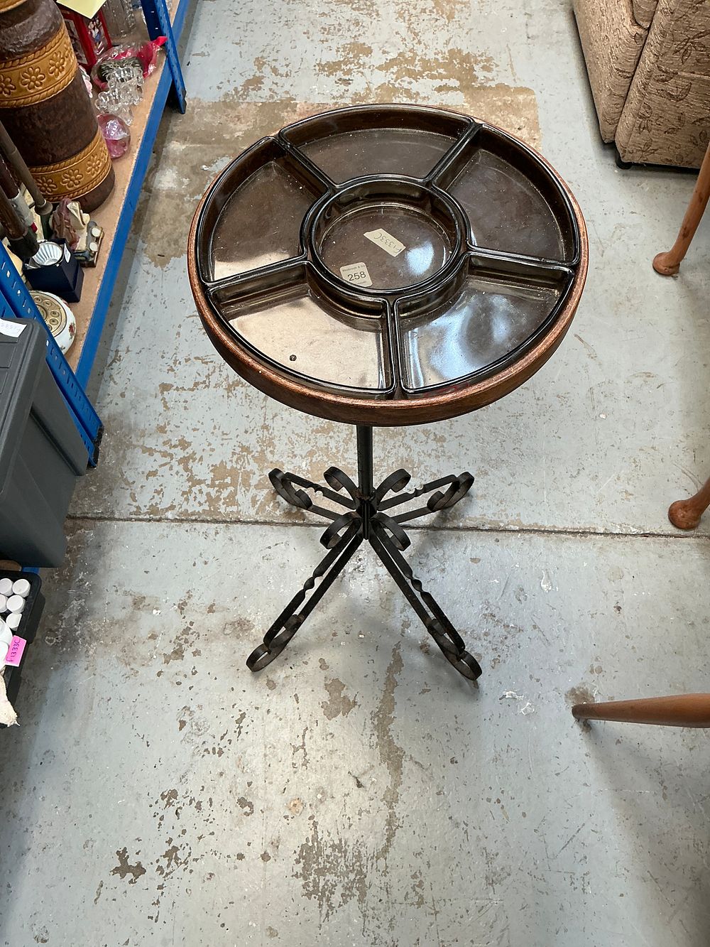 Lot 258: A Mid-Century Modern Style Wrought Iron and Smoked Glass Sectional Serving Table