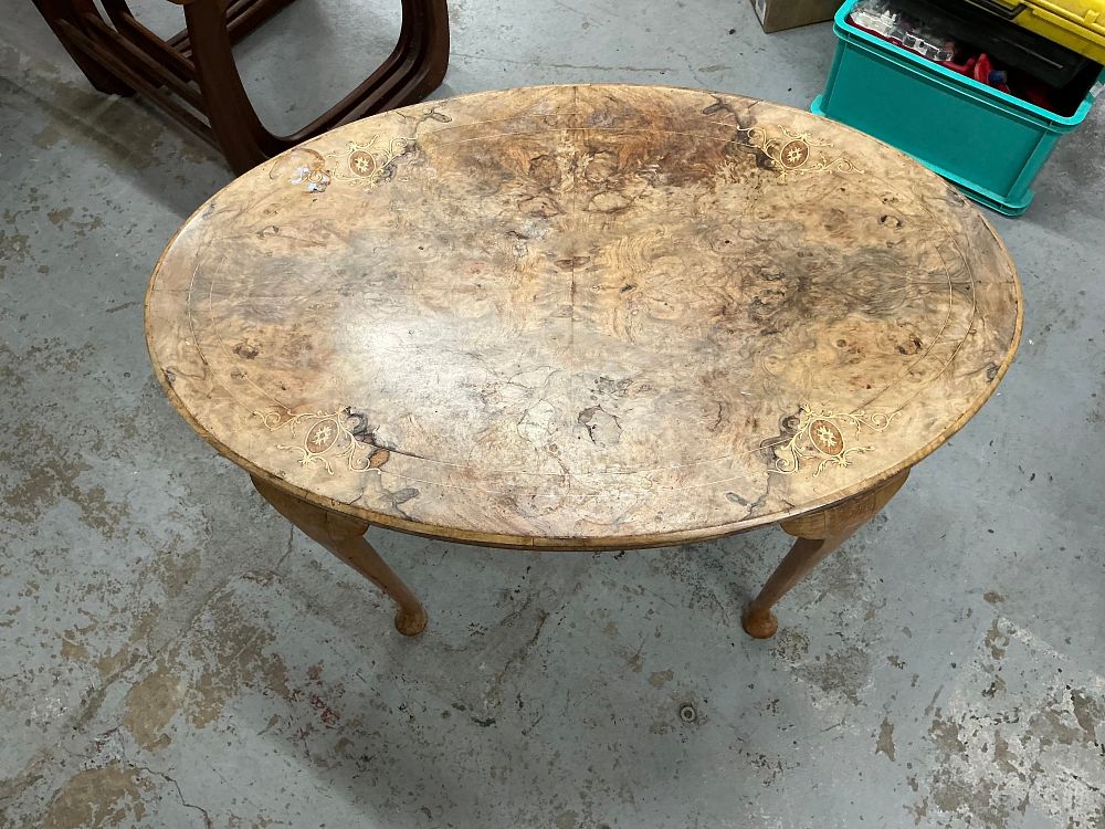 Lot 259: A Queen Anne Style Inlaid Burr Walnut Veneered Oval Coffee Table