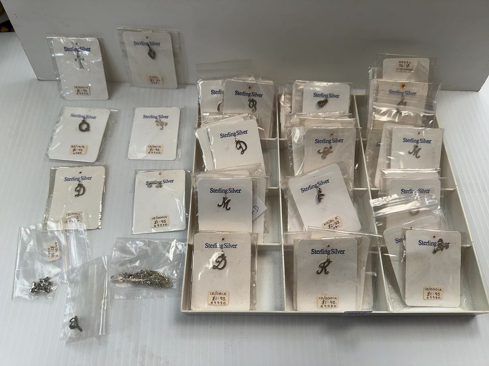Lot 267: A Collection of Sterling Silver Initial Pendant Charms