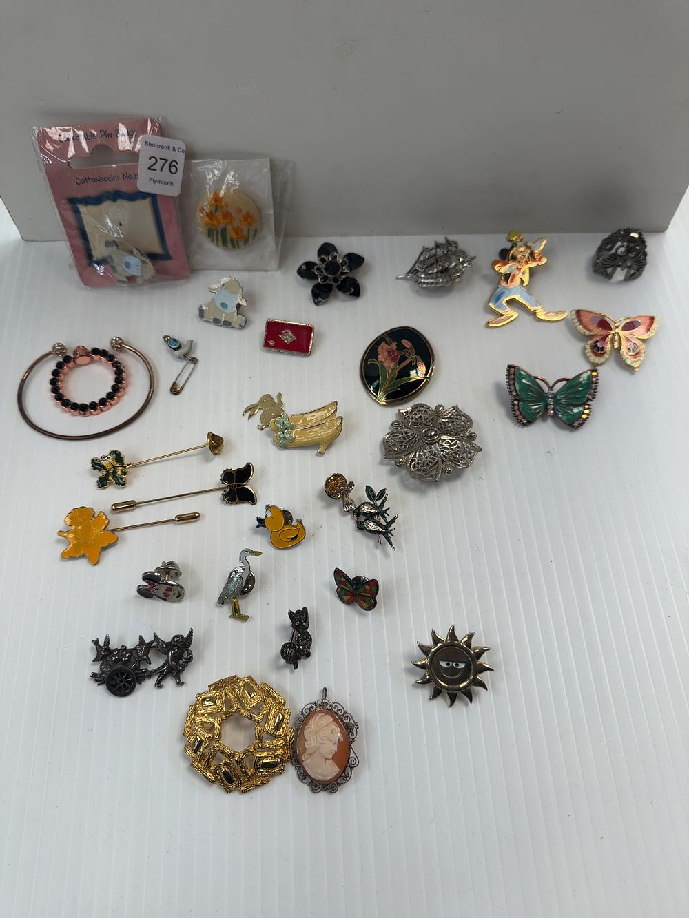 Lot 276: A Collection of Costume Jewellery and Enamel Pins Including Disney and Cottonsocks Examples