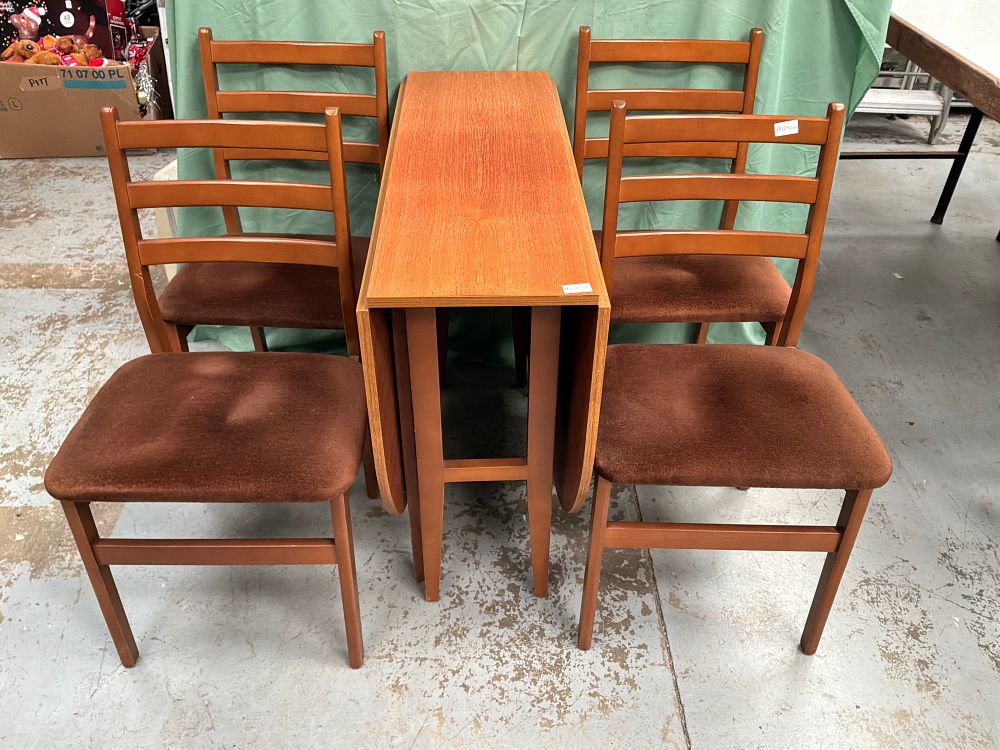 Lot 292: A Mid-Century Modern Style Teak Wood Butterfly Drop-Leaf Dining Suite Comprising a Table and Four Chairs