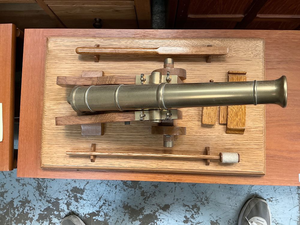 Lot 296: A Detailed Scale Model of a Naval Cannon on a Wooden Plinth