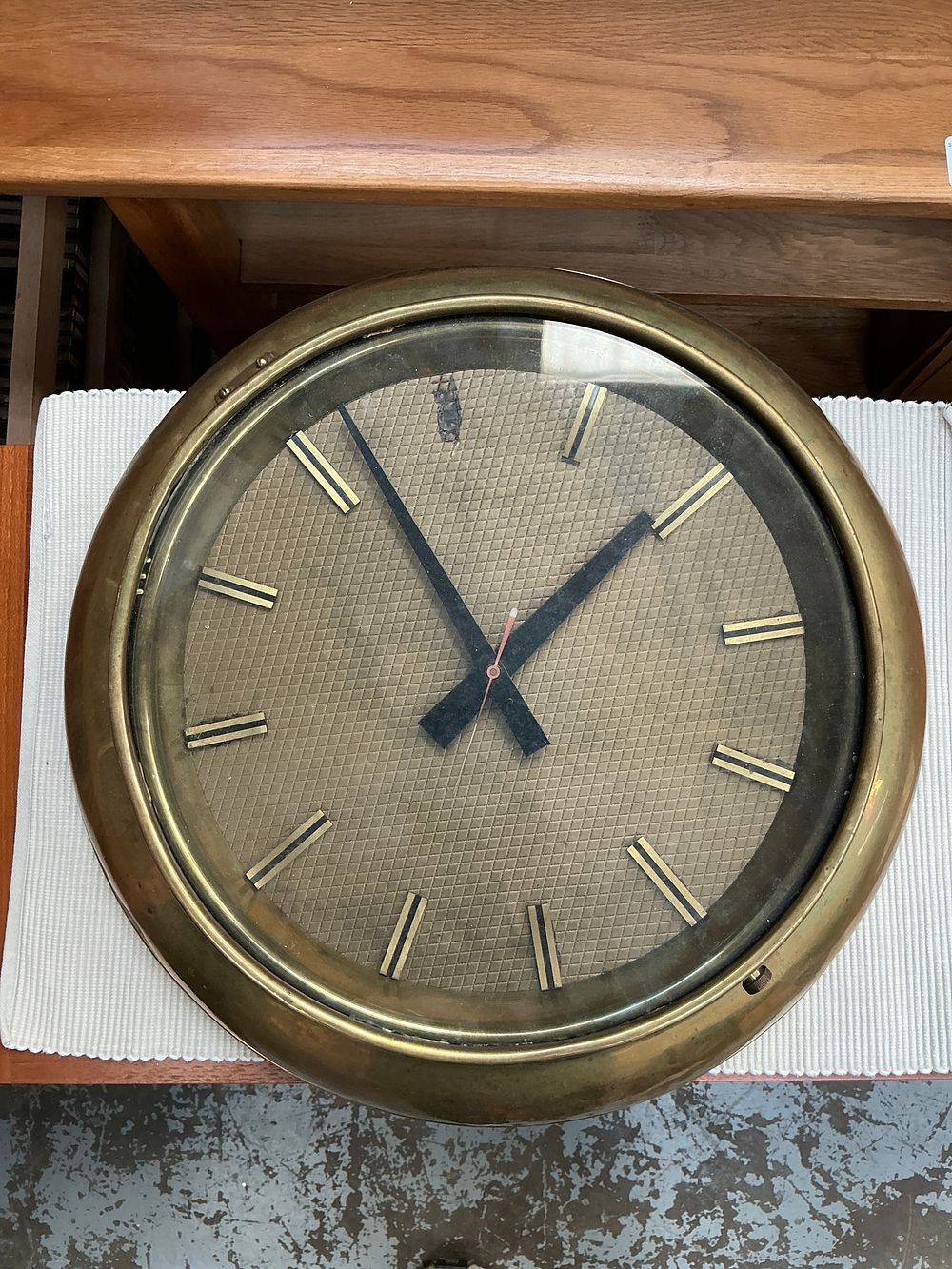 Lot 299: A Spun Brass Cased Bulkhead Style Wall Clock