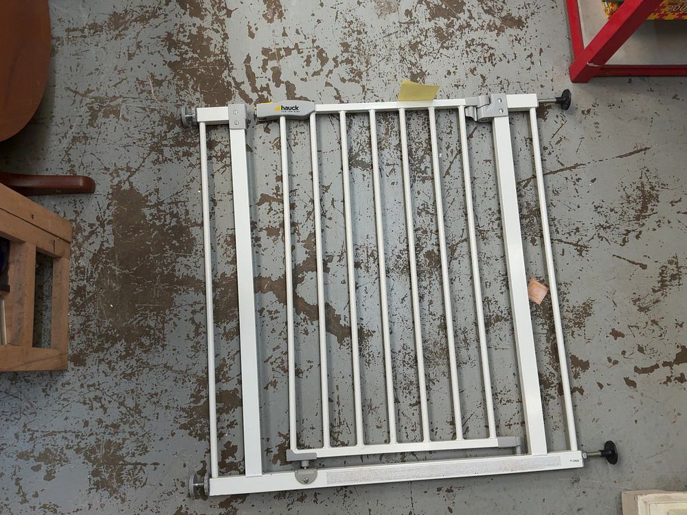 Lot 307: A Group Lot of One Hauck Child Safety Gate and Several Extendable Chrome Curtain Poles