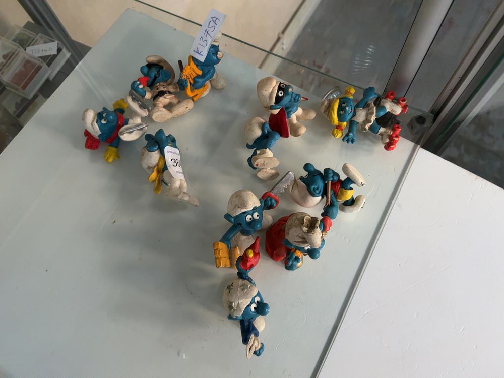 Lot 364: A Collection of Eleven Vintage PVC Smurf Figurines Including Schleich and Bully style Examples