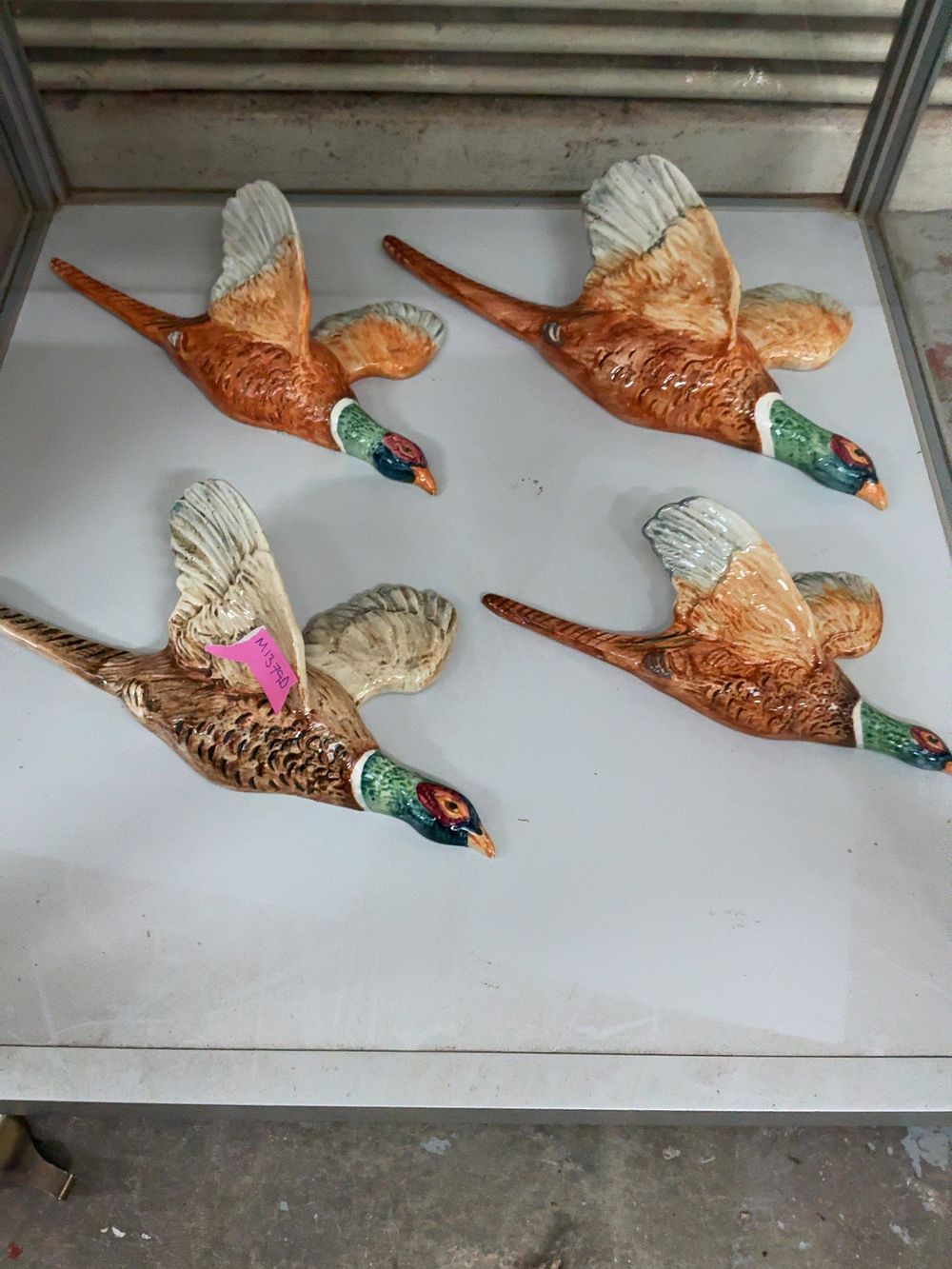 Lot 367: A Set of Four Beswick Ceramic Graduated Pheasant Wall Plaques