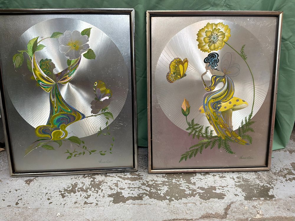 Lot 381: A Pair of Richelle Emblem Mixed Media Foil Panels in Silver Toned Metal Frames