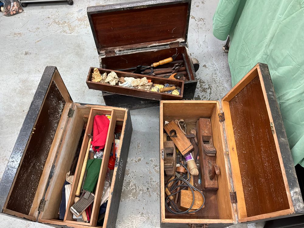 Lot 404: A Collection of Three Antique style Black Painted Wood Tool Chests and Associated Hand Tools