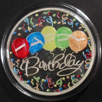 ONE OZ .999 ENAMELED HAPPY BIRTHDAY SILVER ROUND. BID WITH SILVER CITY AUCTIONS ESTIMATE $75 - $100.