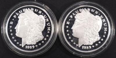 (2) 1 OZ .999 SILVER 1889 MORGAN DESIGN ROUNDS. LEADERS IN ON-LINE AUCTIONS ESTIMATE $80 - $120.