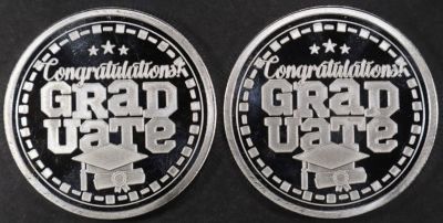 (2) 1 OZ .999 SILVER 2024 CONGRATS GRAD ROUNDS. CHECK OUT OUR UPCOMING AUCTIONS ESTIMATE $120 - $170.