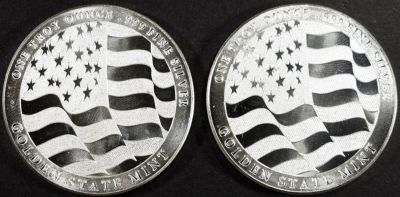 (2) 1 OZ .999 SILVER FLAG ROUNDS. BID WITH SILVER CITY AUCTIONS ESTIMATE $100 - $150.
