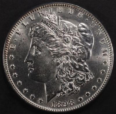 1898 MORGAN DOLLAR CH BU. CHECK OUT OUR UPCOMING AUCTIONS ESTIMATE $100 - $130.