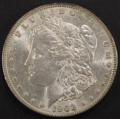 1902 MORGAN DOLLAR AU. BID WITH SILVER CITY AUCTIONS ESTIMATE $100 - $130.