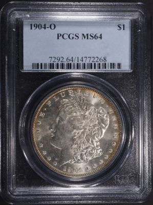1904-O MORGAN DOLLAR PCGS MS64. CHECK OUT OUR UPCOMING AUCTIONS ESTIMATE $130 - $180.